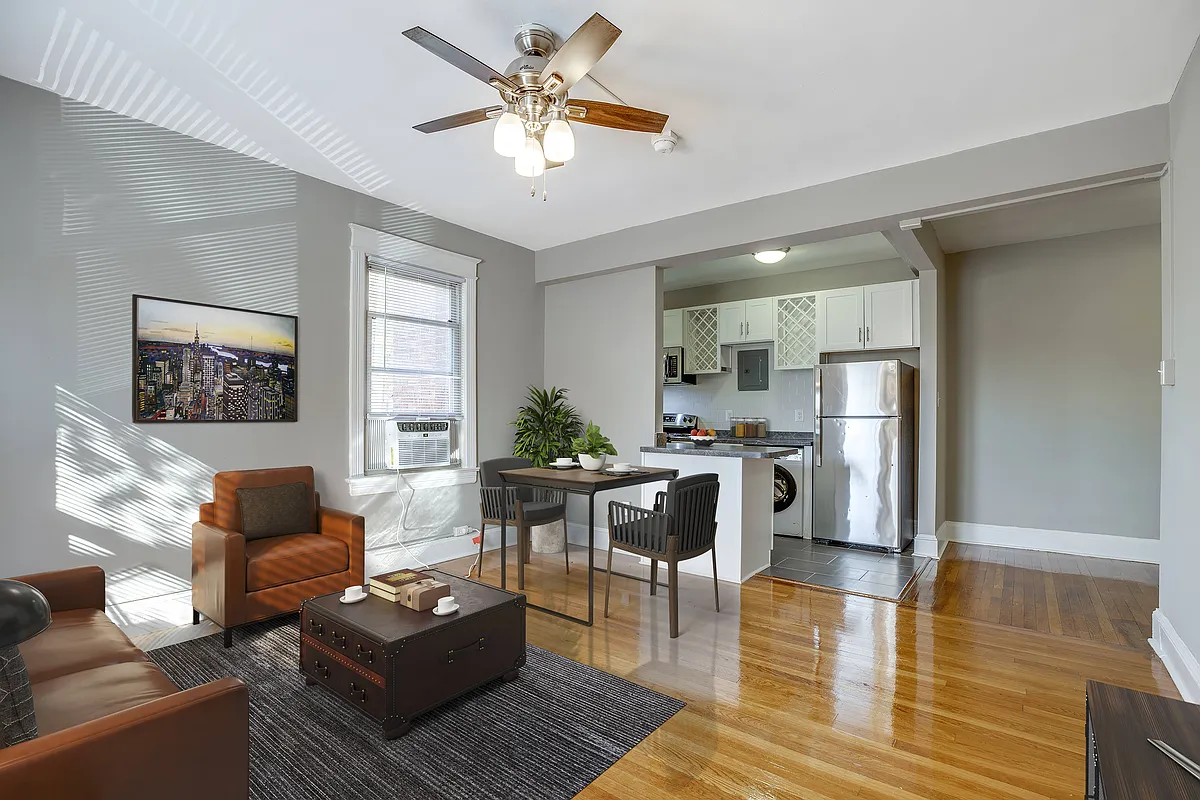 Renovated two-bedroom apartment living area (virtually staged) - 4115 Wisconsin