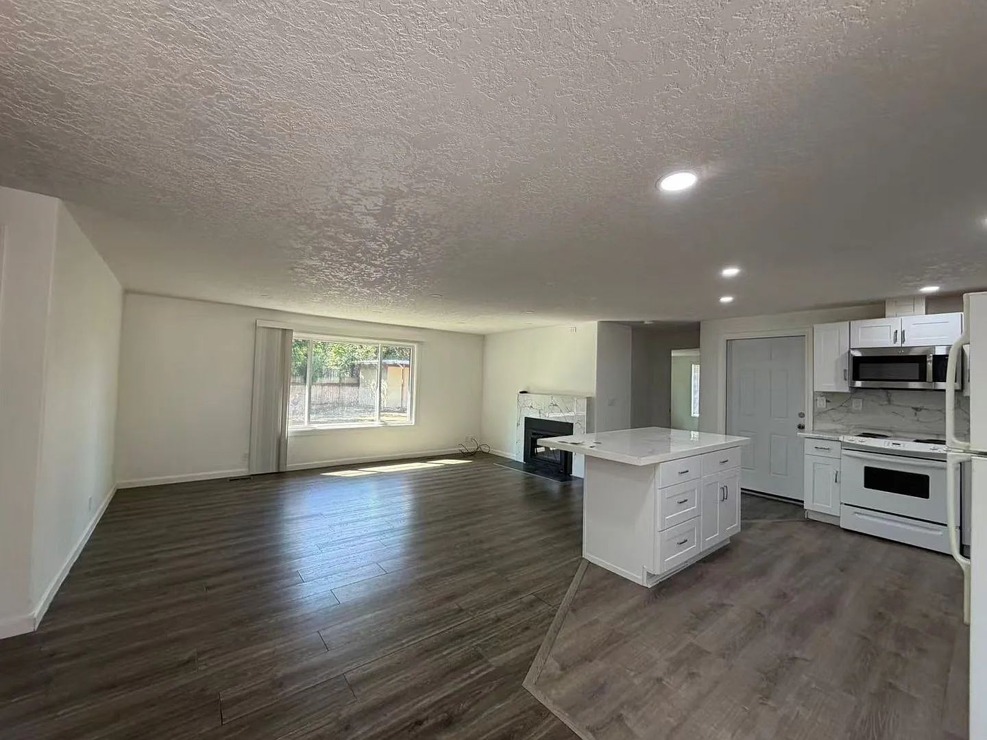 Remodeled Single-Level Home with Fenced Backyard — Photo 3