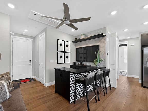 Residence 3 Entrance Living Shown with Built in Bar