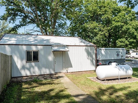 SIDE ENTRY TO THIS OVER SIZED 2 CAR GARAGE LEADS TO LOTS OF BUILT IN STORAGE AND HAS A 100 AMP SUB PANEL