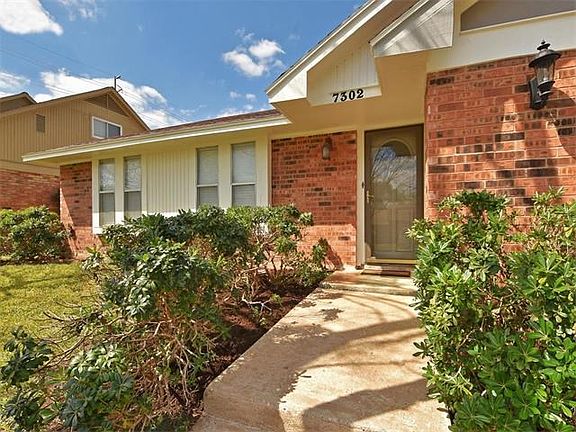 Mature landscaping welcomes you to your front door!