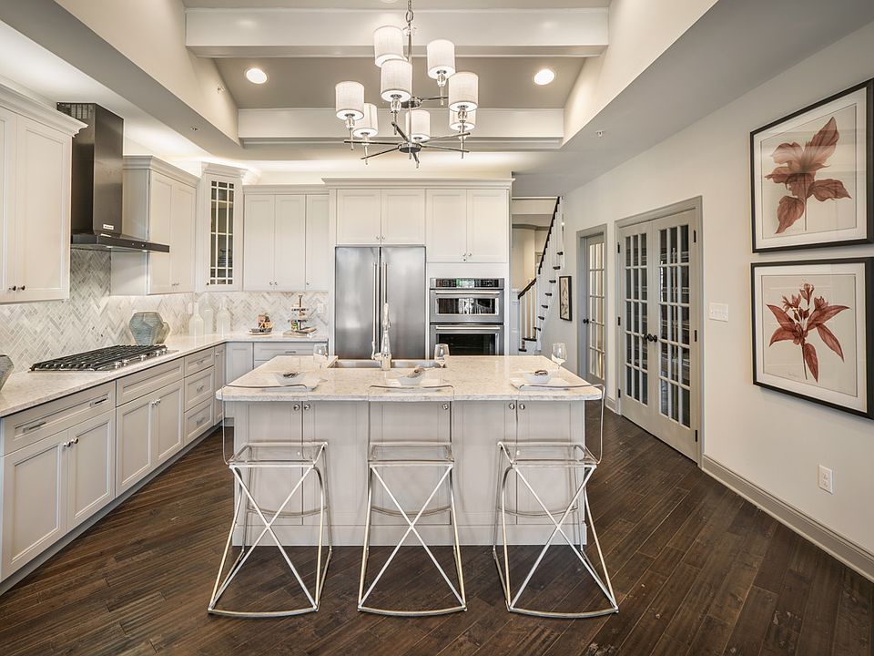 Well-appointed kitchen with large center island and granite countertops