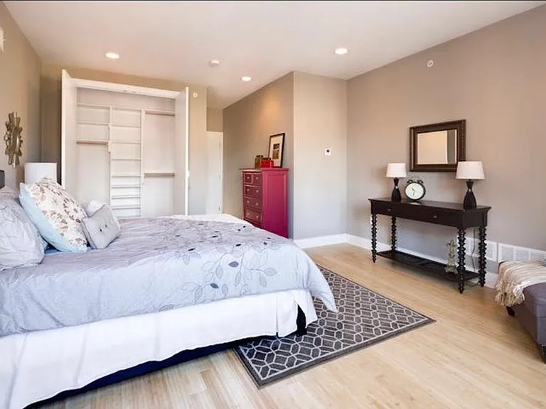 Main bedroom with ample natural light and walk-in closet