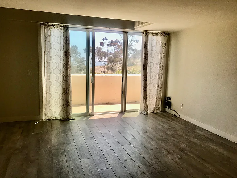 Large Living Room with Tile Wood Floors.
