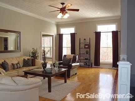 Living Room 19x13
						:
						10ft ceilings / 2piece crown moulding / maple floors w/ cherry inlay.