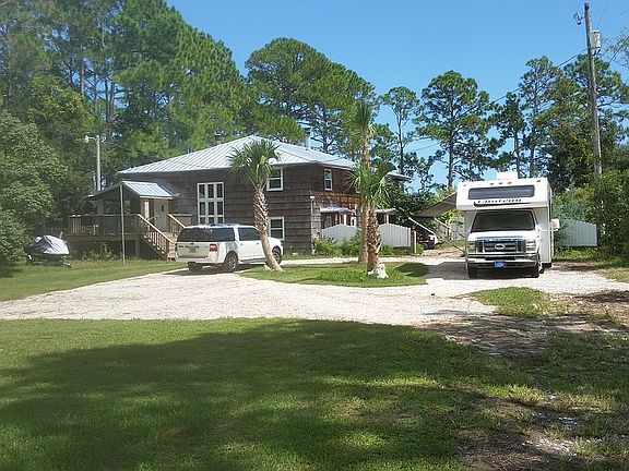 new driveway and palm trees
