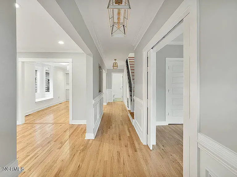 *original listing photo from when we purchased the home (downstairs hallway)