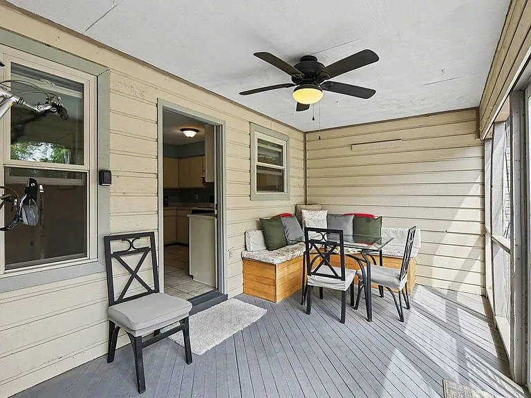 Screened-in porch with seating