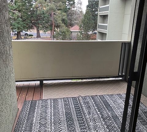 Glass door in living area space opened to the deck and to the left of the deck is enclosed storage area. Nice view and other condos do not have visual access to your unit.