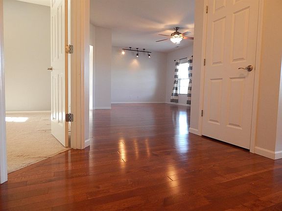 This a view of the gorgeous wood floors as you enter this sun drenched unit