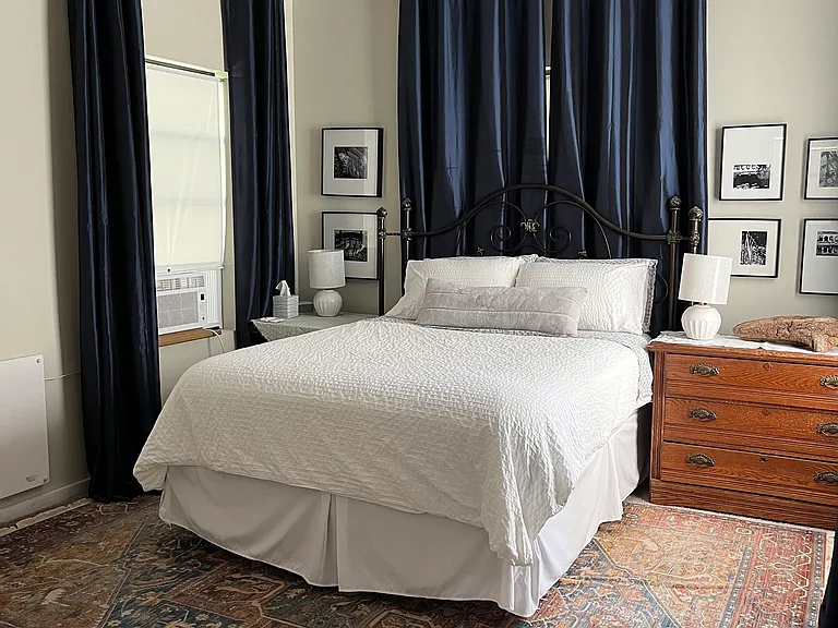ample natural light and layered blinds and blackout curtains for privacy