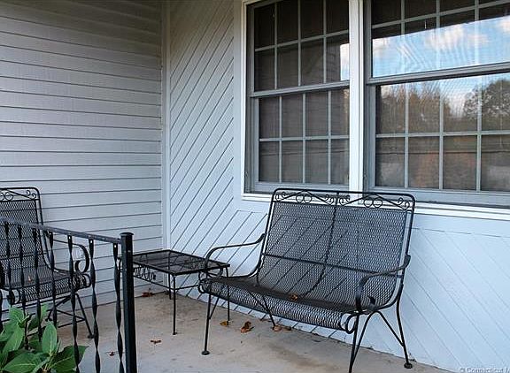 Covered front porch to sit ...