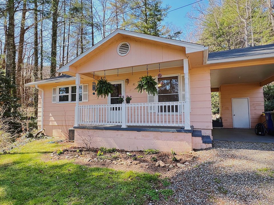 Front of the house with the carport on the right side.