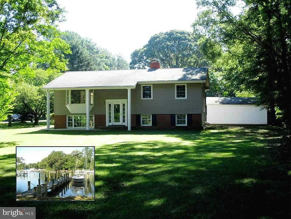 Waterfront house with large level lot, deep water pier and plenty of room to roam. Garage used mostly for storage /work shop and