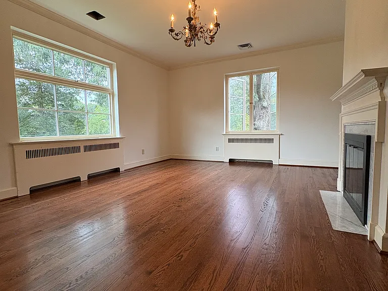 Primary suite with ensuite marble bathroom. Custom French casement window to view one of the large, 125yr plus oaks, and awning window above the bed area. Floors redone 2025. Walls and ceilings reskimmed and painted 2025. Gas fireplace