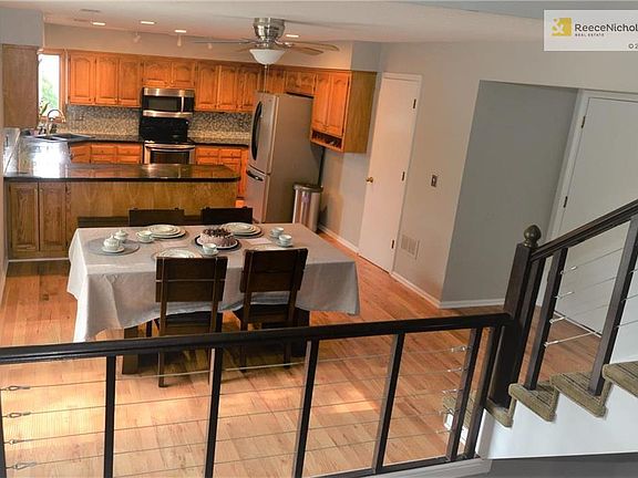 Kitchen and dining viewed from main level - Garage entrance to right