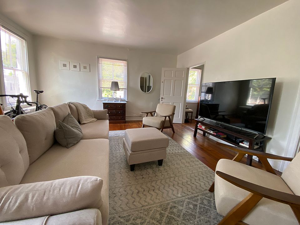 large living room with new furnishings and 56" TV