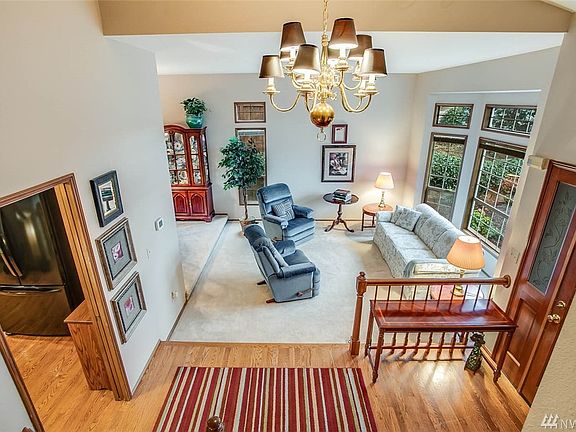 From the upper landing, you can appreciate the circular floor plan of this home, connecting formal living spaces with the kitchen for easy entertaining. 