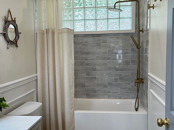 Updated full bathroom on first floor with rain shower and tub