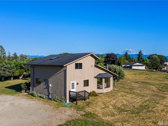 In addition to the front porch and additional entry, there is another access to the back of the property from the separate laundry room