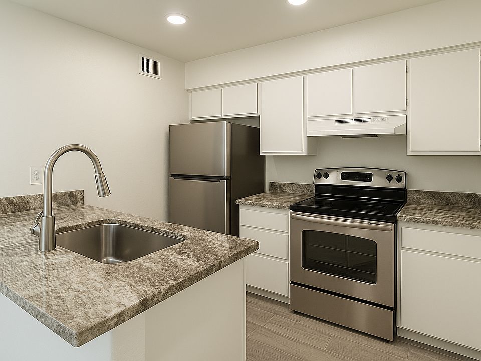 Kitchen - New Granite Countertops, sink & Refrigerator. Freshly painted cabinets.
