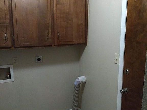 Laundry off kitchen.