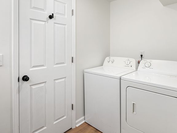 Full-sized, in-unit washer and dryer. Located in the bathroom area.