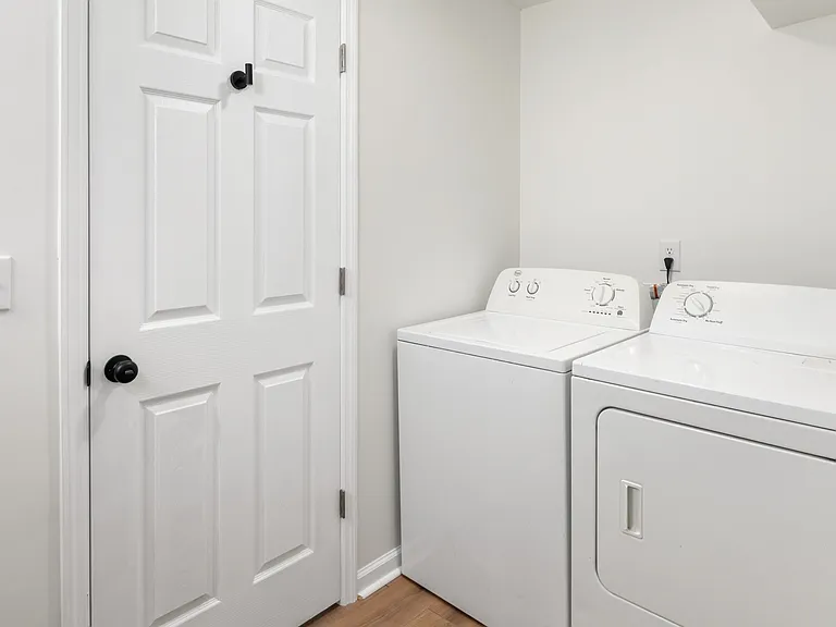 Full-sized, in-unit washer and dryer. Located in the bathroom area.