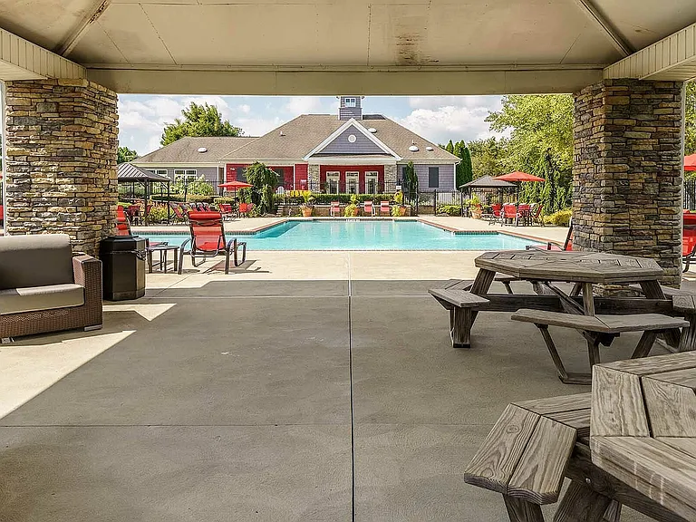 Relax and enjoy this elegant poolside retreat, perfect for sunny afternoons.