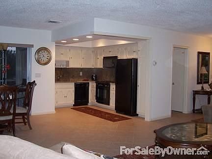 Granite Counters and 18 in neutral tile