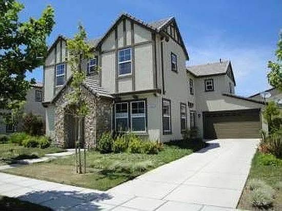 Entrance + Three Car Garage