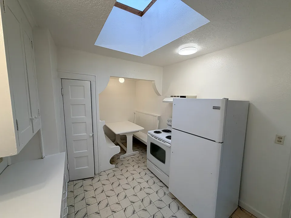 Kitchen features a large skylight, pantry, and breakfast nook.
