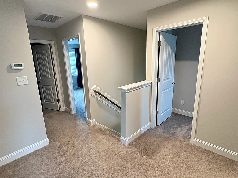 Second story landing, laundry adjacent