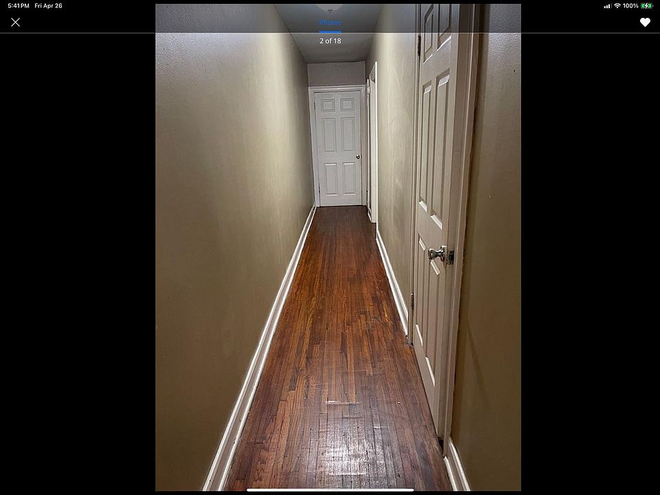 Long hall way back to the back bedroom passing the first bedroom.