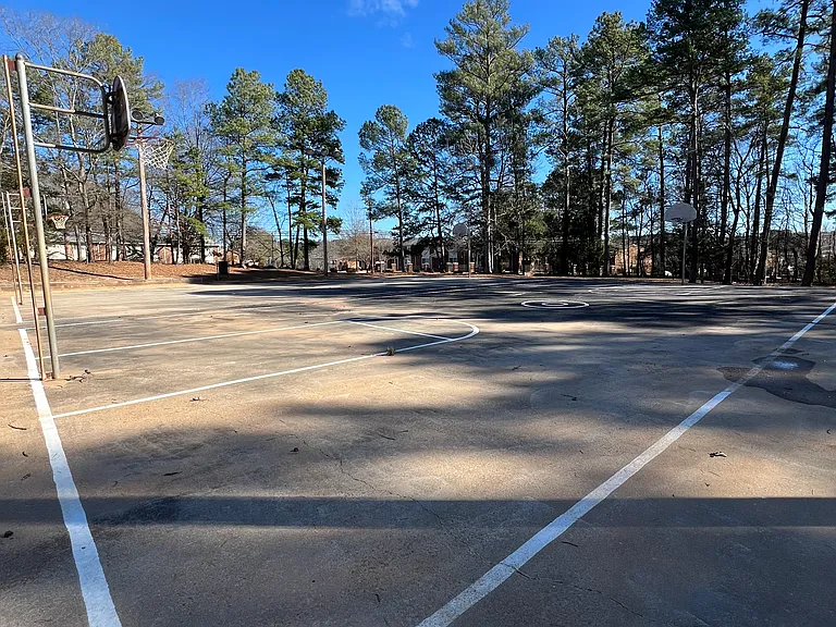 Park directly across the street with playground, basketball courts, walking trails.
