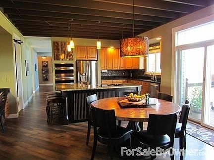 Kitchen & Breakfast Area
						:
						Planning desk on left. Sink overlooks pool & yard. Sliding doors to deck.