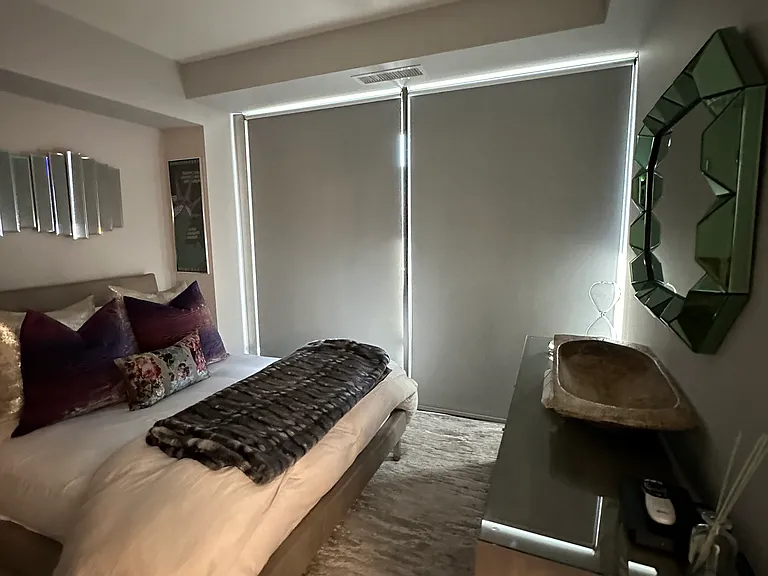Custom blackout blinds in the master bedroom