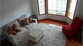 Living Room with bay window and vaulted ceiling
