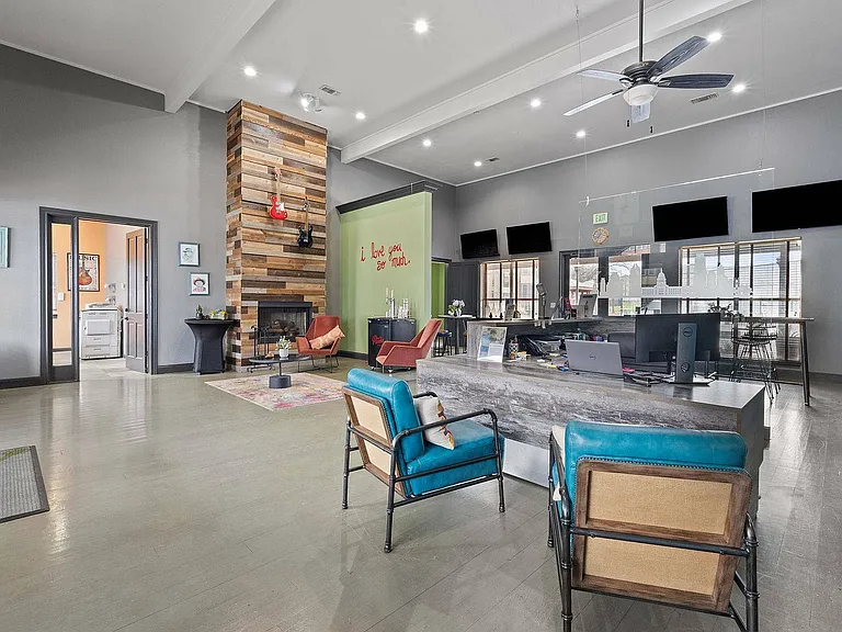 Stylish Community Lounge with Fireplace at Ovation Apartments in Austin, TX
