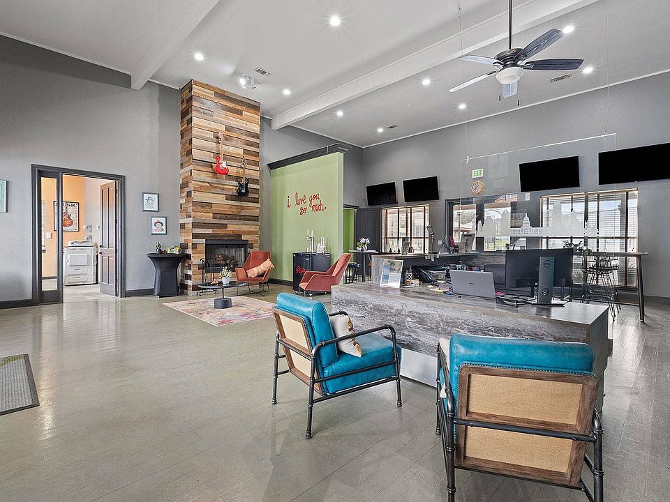 Stylish Community Lounge with Fireplace at Ovation Apartments in Austin, TX