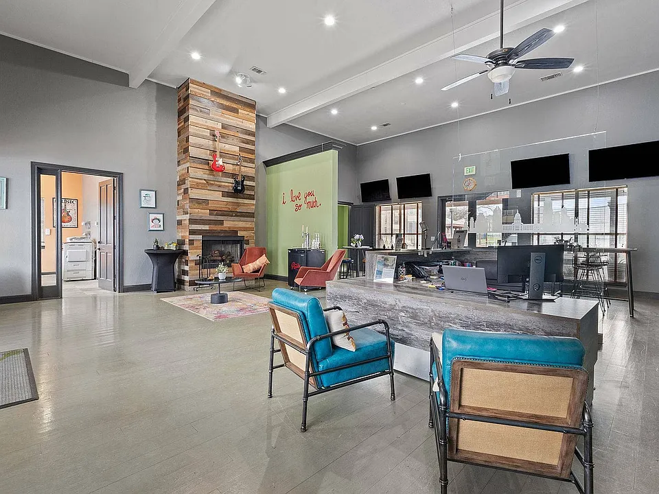 Stylish Community Lounge with Fireplace at Ovation Apartments in Austin, TX