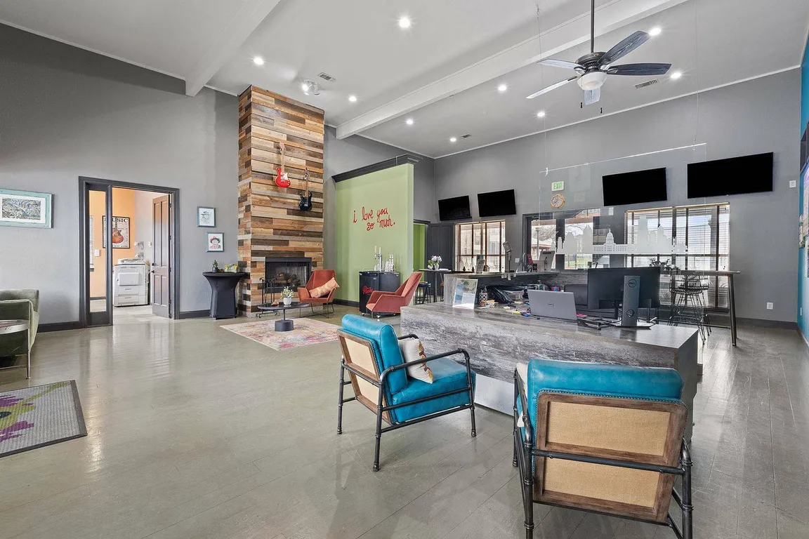 Stylish Community Lounge with Fireplace at Ovation Apartments in Austin, TX