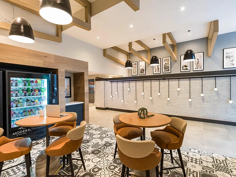 Grab a seat and recharge in this stylish lounge, complete with cafe seating, artistic design, and convenient vending options.