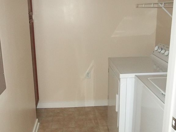 Laundry Room with full size washer and dryers