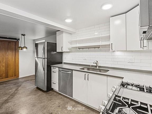Brand new kitchen upgrade with stainless steel appliances.