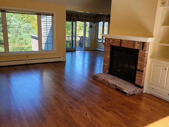 Main living area and dining, fireplace and built in storage