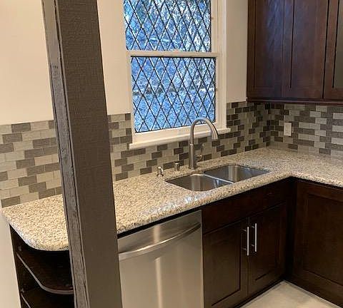 A closer look at your Bevel glass window, sink, dishwasher, and note the three shelves which end the countertop .