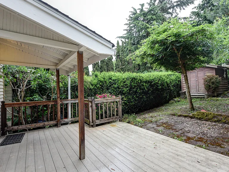 back deck with yard and shed