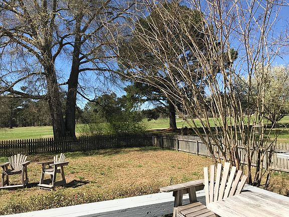 Majestic oak with golf course beyond.