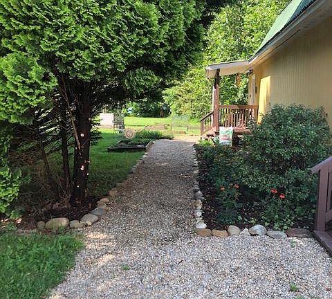 Entrance to apartment ( stairway up is behind the building ) Has a shed for some storage and garden equipment